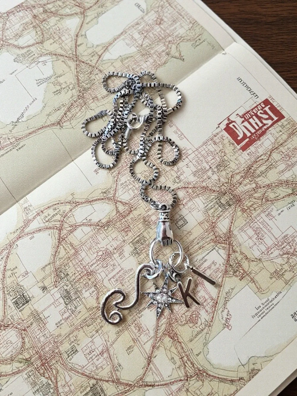 Monk DND necklace with the wind, a star, and KI Dungeons and Dragons jewelry